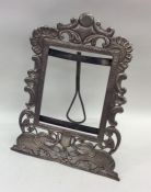 A tall Indian silver frame decorated with elephant
