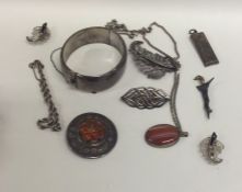 A bag containing a heavy silver bangle, ingot etc.