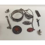 A bag containing a heavy silver bangle, ingot etc.