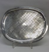 A large Georgian oval silver mazarine with pierced