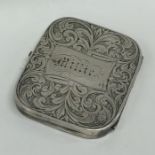 An engraved silver miniature hinged purse decorate
