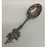 A Dutch silver spoon mounted with a galleon, beari