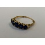 A sapphire five stone half hoop ring in 18 carat m