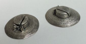 A pair of unusual modern silver menu holders in th