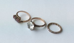 A group of three heavy 9 carat gem set rings. Appr