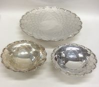 An attractive three piece silver sweet dish set wi