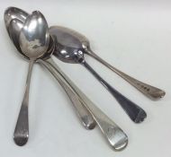 A large silver dessert spoon together with other s