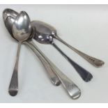 A large silver dessert spoon together with other s