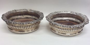 A good pair of Georgian silver wine coasters, the