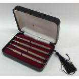 A cased set of four silver Bridge pencils with eng