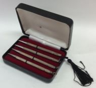 A cased set of four silver Bridge pencils with eng