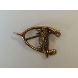 A gold brooch mounted with a Kookaburra. Approx. 2