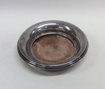 A small silver coaster on velvet base. Chester. By