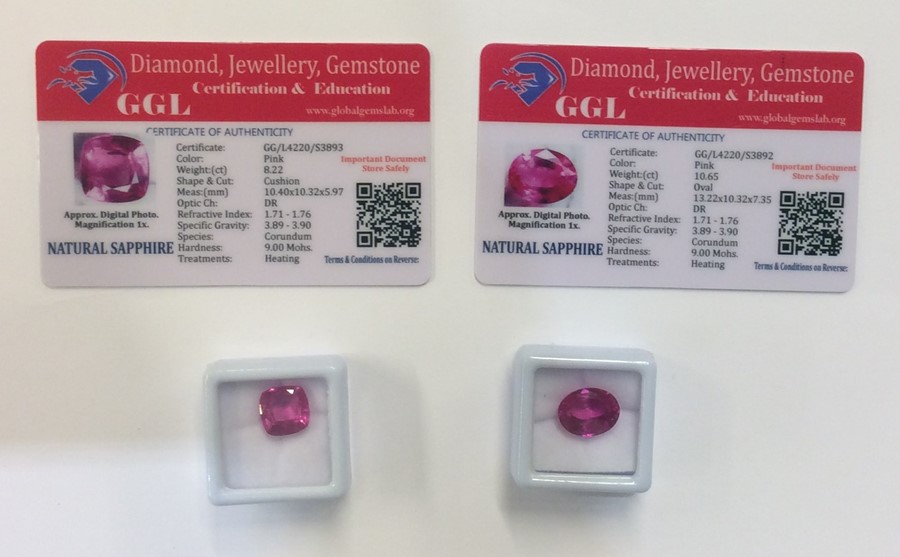 Two unmounted natural pink sapphires complete with