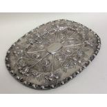 An 18th Century oval embossed silver letter tray d