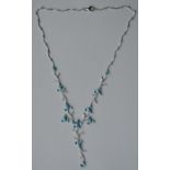 An attractive diamond and blue topaz necklet decor