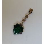 A gold and malachite clip. Approx. 3.6 grams. Est.