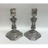 A good pair of modern cast silver candlesticks on
