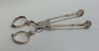 A pair of Georgian silver sugar scissors of typica