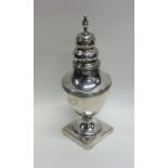 A campana shaped Georgian silver caster. London. B