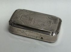 An unusual silver hinged top snuff box decorated w