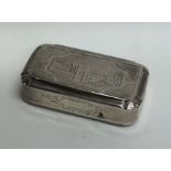 An unusual silver hinged top snuff box decorated w