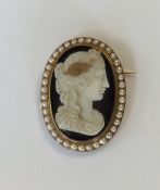 A large hard stone oval cameo of a lady's head wit