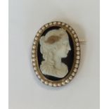 A large hard stone oval cameo of a lady's head wit