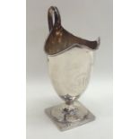 A tall Georgian silver Adams' style cream jug on s