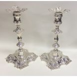 A good pair of Georgian cast silver candlesticks w