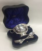 A cased silver two handled cup together with a chr