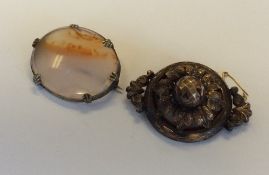 Two gilt mourning brooches. Approx. 24 grams. Est.