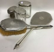 An engine turned two piece dressing table set toge