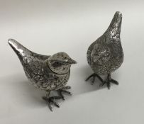 A pair of novelty silver peppers in the form of wr