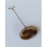 An Antique agate and gold oval brooch. Approx. 10