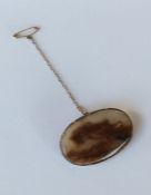 An Antique agate and gold oval brooch. Approx. 10