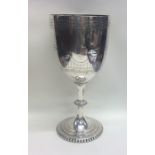 A large Victorian silver goblet with bright cut de