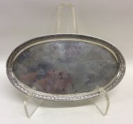 An Italian silver oval snuffer tray with leaf deco