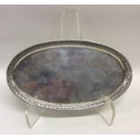 An Italian silver oval snuffer tray with leaf deco