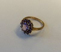 A 9 carat amethyst cluster ring. Approx. 3.2 grams