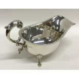 An Edwardian silver sauce boat with gadroon rim. B