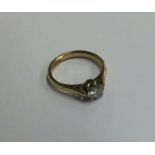 A diamond single stone ring in 18 carat claw mount