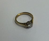 A diamond single stone ring in 18 carat claw mount