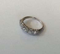 A good quality platinum five stone half hoop ring.