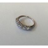 A good quality platinum five stone half hoop ring.