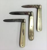 Three small silver and MOP fruit knives with plain