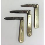 Three small silver and MOP fruit knives with plain