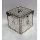 An unusual Georgian silver tea caddy in the form o