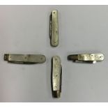 Four small silver and MOP fruit knives engraved wi
