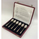 A boxed set of six silver coffee spoons. Approx. 6